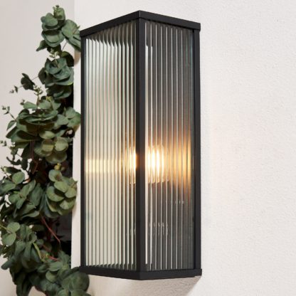 f4f8c4c2df503b5b95f6a133b6e1f808484c8e03de2703c28faca64154128ee1.jpg An Image of Ribbed Glass Outdoor Wall Box Lantern