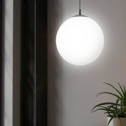 f65f0f0c2d8587fff3903e63e9e5300216d6e9a5280cb18bd416311d83ee6c61.jpg An Image of EGLO Rondo 3 Spherical Opal Glass Pendant Light Black