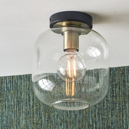846c3cfb87330b13687ae79b031d35bbfa738308e137e3ddd778ede4efe11522.jpg An Image of Florence Metal and Glass Flush Pendant Black