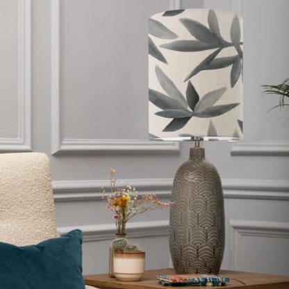 8d6da488176dd14f8651b1d45ebc7cea01316607f401d117c4d63f03abb0573f.jpg An Image of Jadis Table Lamp with Silverwood Shade Silverwood Blue Grey