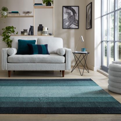 228392e870f0975007bbd1c535dfeddc30294bc9840c1c85fcf5167b0ab984e3.jpg An Image of Ombre Stripe Rug Blue