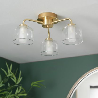 4521863c5c7a9205d00d614dbd7aeeaf357778c9b41062b4c5f8305181a119f5.jpg An Image of Shore Light Ava Metal & Glass Flush Ceiling Light - Gold