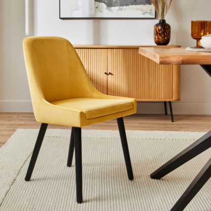 9e7b5d56d357cabdafb3efc65a6c6f39b2c0e82f09a72012468a5b7d04f5807f.jpg An Image of Eddie Velvet Dining Chair Old Gold