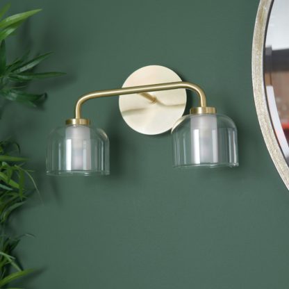 d00afe82c74d9d6510eb53c29a0489a8df3aa90110627bc2f9d7e35b32ea013d.jpg An Image of Shore Light Ava Metal & Glass 2 Light Wall Light - Gold