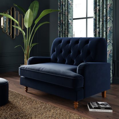 0a92462b7ac42c55f9f39371c6d2d66479979103bd5c1c81ce6d08fe989a0544.jpg An Image of Beatrice Buttoned Velvet Snuggle Chair Velvet Olive