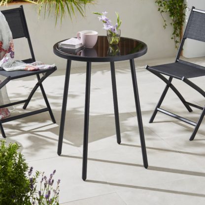 1118b01f4636ecc6568098ac57a85125dcc73242ae7e4bc3108e15cb16ab200a.jpg An Image of Small Black Glass Dining Table Black