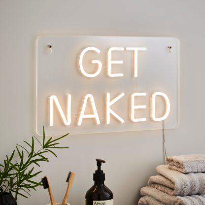 8d3869aa09af893d307be7b8392ce446a1cf20e3b509da33d64895da5962a80f.jpg An Image of 'Get Naked' Neon Sign Clear