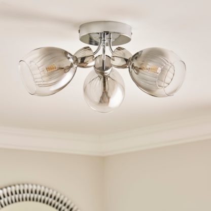 ab9d92b84be485043e086a4e356d4399606a634e46a14029967417eb4724273b.jpg An Image of Sylvia 3 Light Flush Ceiling Light Silver