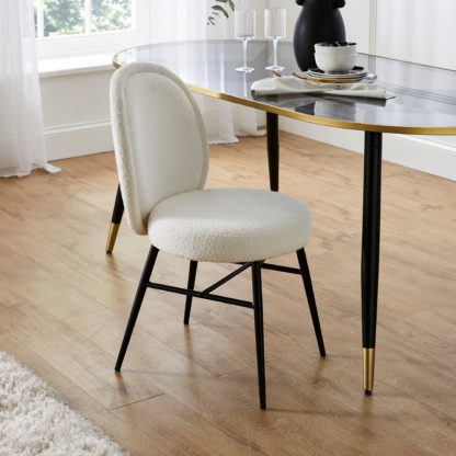 0c35fe87e32a3546dd2470eb7c9c9587e218cd906d26582bb0123f8634dac707.jpg An Image of Renata Dining Chair, Boucle Ivory