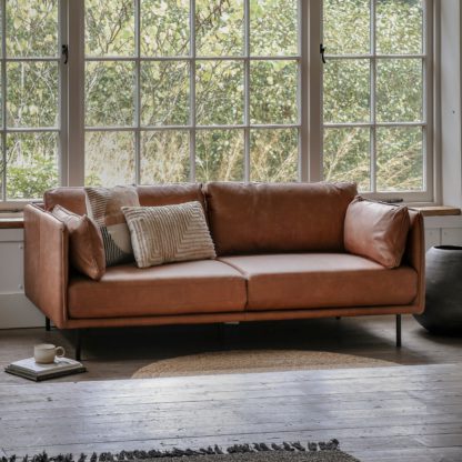f292ab85255064f04ef464ac28c12388ed60f1bbd9fc0d07b8da465a81365e0d.jpg An Image of Vail Sofa, Leather Brown