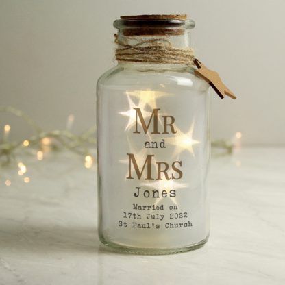 fe8597ccd8bba952184fe0d3bea26076d66a323114427d9f921eedbaa10a2294.jpg An Image of Personalised Mr and Mrs Glass LED Jar Clear