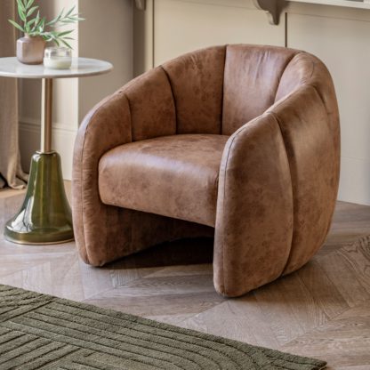 fec3342fbdcf9267aa8932d5bb18d023dda71cc5855a52f3ff7483e974a636d7.jpg An Image of Brea Tub Chair, Leather Tan