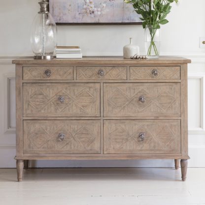 8091306fc93aaca6efe2c225fe9d3f74c849f5122a36ea98c8315646c6d0a6de.jpg An Image of Modesto 7 Drawer Chest Natural