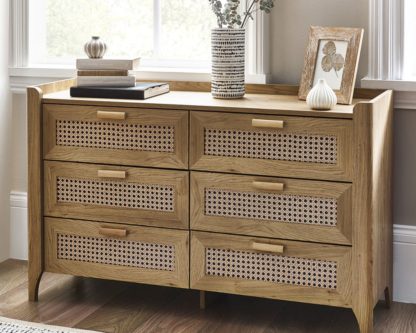 76675182ad43cbb31525a15ce61316c1c44eca19abc40952618e25ce8e0d86cf.jpg An Image of Sydney – Rattan Wide 6 Drawer Chest of Drawers – Oak – Wooden – Happy Beds