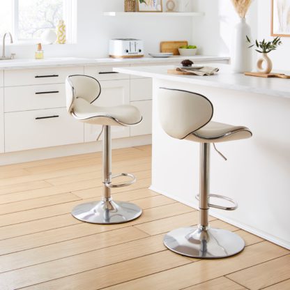 f14538ffecec10d30a4824ef489f18cf0a94dcbbbdbf6c23f7213c0215c8e91a.jpg An Image of Donte Adjustable Height Swivel Bar Stool Tan