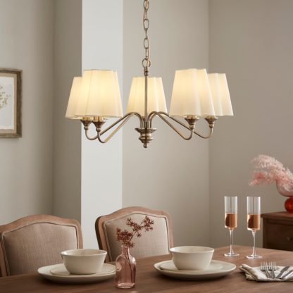 8112e7fce1350950dad2ba38861e5cab21beb7f75de59a11ab5fc0908a84f14d.jpg An Image of Nancy Metal 5 Light Chandelier Silver