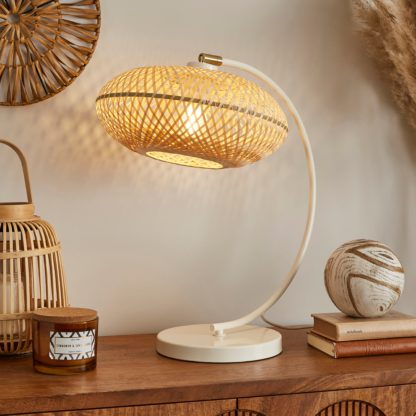 b1e610b5d34375a6565b8d3c03c2b8a0813ad2a0d44a2423dfd9d6260fd9c578.jpg An Image of Lise Bamboo Arched Adjustable Table Lamp Natural