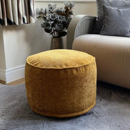 2100ff1a25f43ac8dad47c8ec7783e23c0f56209eff03637f2425090a1fb58f9.jpg An Image of Daro Waffle Round Pouffe