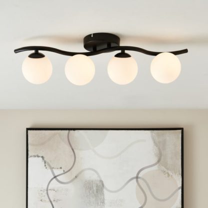 2bf2412f8e95d9e629604c48f7bcd9cc670ae20138d344c2a65c99d691e77dc6.jpg An Image of Wiggle Modern 4 Light Adjustable Spotlight Bar