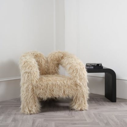 2f6bb77d176374d2e89a3cd9f1a655626c5cbc70cb00a812279421c89d2a95b4.jpg An Image of Freyja Ivory Faux Fur Accent Chair