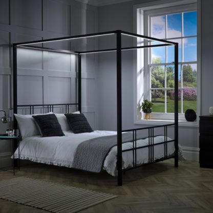 5dbd018f379e5cbd710f9d59094a0f4686764785a342b6786a34071d849d024f.jpg An Image of X Rocker Fern 4 Poster Bed with LED Lights