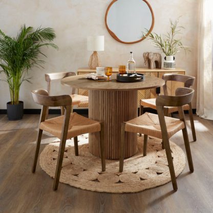 5e0556d4d873e209bd609a529db8467efec8022c6f5341c052cb1e5dc307b66d.jpg An Image of Amari Round Dining Table with Melia Dark Stained Dining Chairs