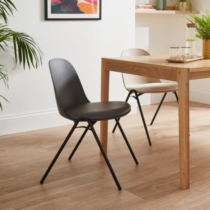 7fa0308fc26daf7dbf1b7bdef0fe4c004589a7dcd33926dc8841a293464c73ac.jpg An Image of Burton Dining Chair, Faux Leather