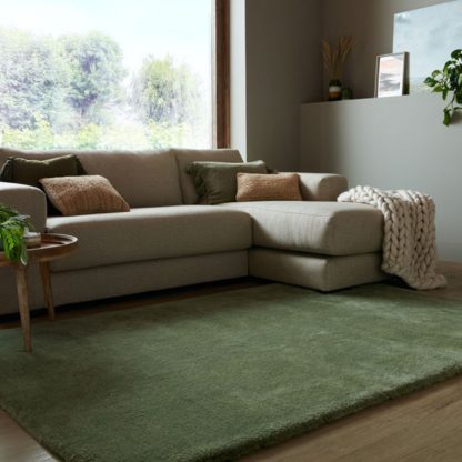 81f55fc36dc4a9a47981fde1a459ef89836cd00a11fd87a44686b1fef4872f5e.jpg An Image of Faroe Wool Look Washable Faux Fur Rug