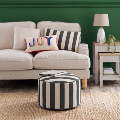 a8db18c42d9275d8c10e0f97eafe8034b4dcfb542547446062c9d7f1b16513d0.jpg An Image of Beatrice Stripe Pouffe