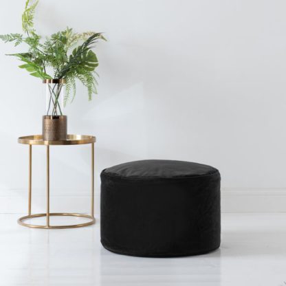 ba3427c0ecee791c0d712f4dd98e4202113906f65d3efe1394fc41aad0e50b12.jpg An Image of Eliza Velvet Pouffe