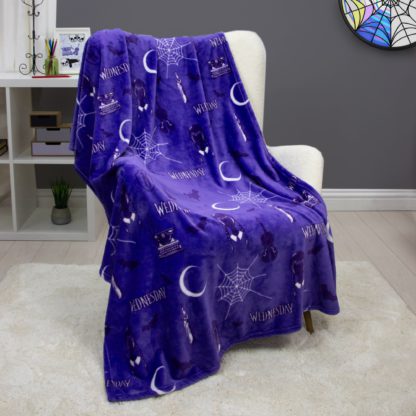 f71e667f4810dd328f89804d65044ba6353353009c7d2cac9a9eee2717a80ca9.jpg An Image of Wednesday Destined Fleece Blanket Purple